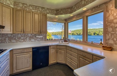 Set along the shoreline of Lower Saranac Lake within the - photo 21