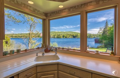 Set along the shoreline of Lower Saranac Lake within the - photo 22