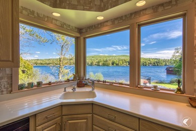 Set along the shoreline of Lower Saranac Lake within the - photo 23