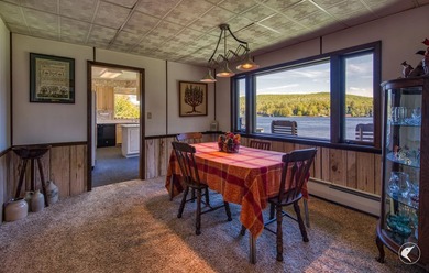 Set along the shoreline of Lower Saranac Lake within the - photo 24