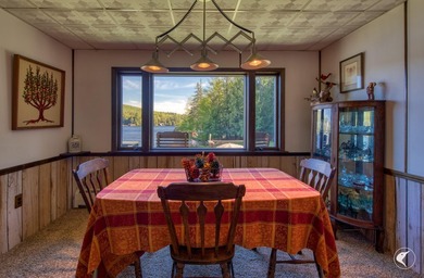 Set along the shoreline of Lower Saranac Lake within the - photo 25