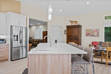 Fully renovated and move-in ready, this stunning villa offers - photo 11