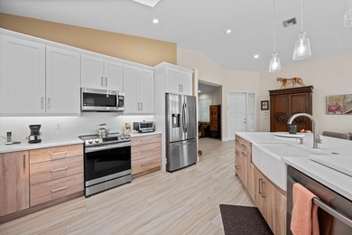 Fully renovated and move-in ready, this stunning villa offers - photo 12