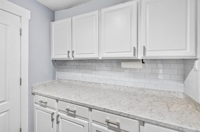 Nestled on a .54 acre corner cul-de-sac lot in the gated - photo 49