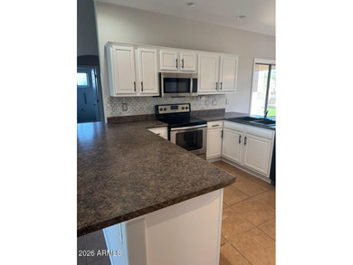 Amazing LAKE FRONT 3 bed 2 bath, fully landscaped TURF front and - photo 2