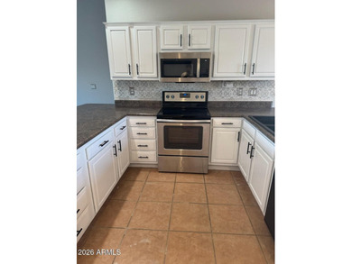 Amazing LAKE FRONT 3 bed 2 bath, fully landscaped TURF front and - photo 3