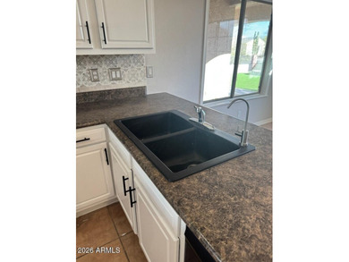 Amazing LAKE FRONT 3 bed 2 bath, fully landscaped TURF front and - photo 4
