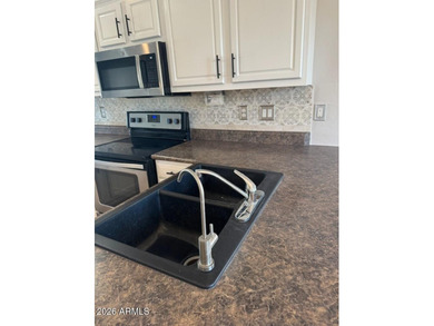 Amazing LAKE FRONT 3 bed 2 bath, fully landscaped TURF front and - photo 5