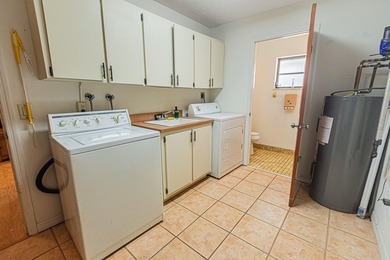 Tropical living awaits in Sandpiper Bay! Situated on an - photo 17