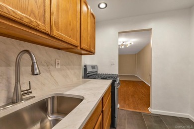 Experience modern comfort in this oversized one-bedroom COOP - photo 17