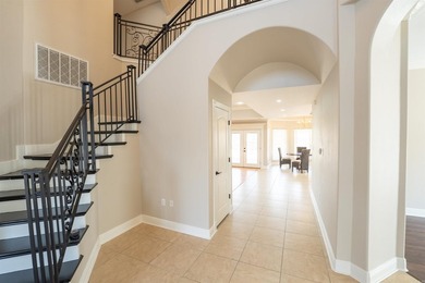 Oversized double entry doors open to a grand two-story foyer - photo 23