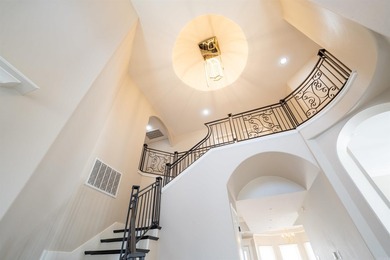 Oversized double entry doors open to a grand two-story foyer - photo 24
