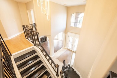 Oversized double entry doors open to a grand two-story foyer - photo 25