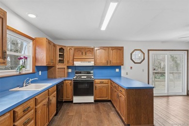 Set on a quiet, tree-lined cul-de-sac in Wading River and - photo 8