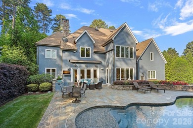 Set on a beautifully landscaped corner lot in a highly - photo 2