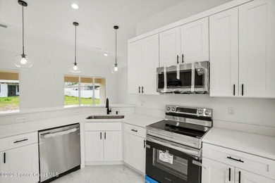 This beautifully designed 4 bed 2 bath concrete block home - photo 2