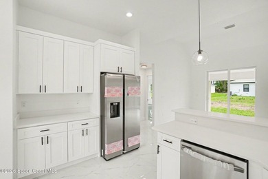 This beautifully designed 4 bed 2 bath concrete block home - photo 4