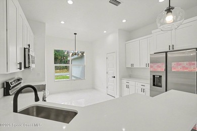 This beautifully designed 4 bed 2 bath concrete block home - photo 6