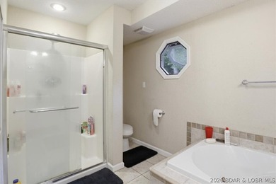 This stunning 4-bedroom, 3-bathroom lake home offers the perfect - photo 14