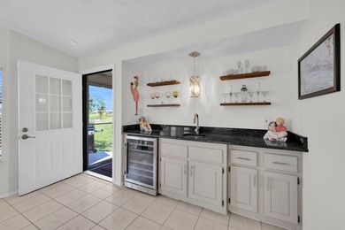 LAND OWNED 2/2 with rare 1 car garage! Nestled on a on a quiet - photo 13