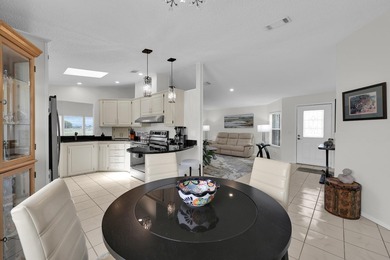 LAND OWNED 2/2 with rare 1 car garage! Nestled on a on a quiet - photo 16