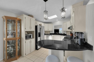 LAND OWNED 2/2 with rare 1 car garage! Nestled on a on a quiet - photo 17