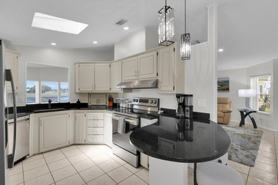 LAND OWNED 2/2 with rare 1 car garage! Nestled on a on a quiet - photo 18