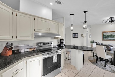 LAND OWNED 2/2 with rare 1 car garage! Nestled on a on a quiet - photo 19
