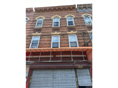 This meticulously maintained mixed-use building offers the - photo 1