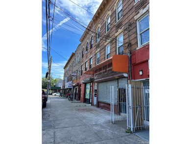 This meticulously maintained mixed-use building offers the - photo 2