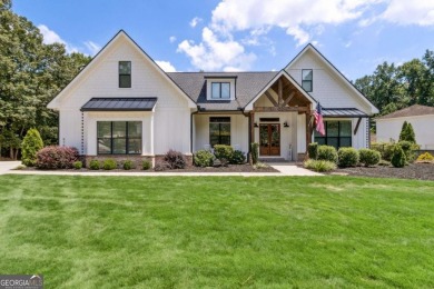 Lake Home For Sale in Flowery Branch, Georgia