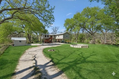 215' of shoreline. Wide yard. Meadow Lake living done right - photo 11