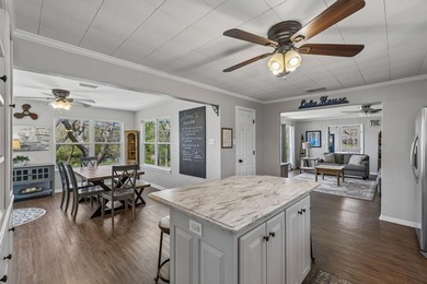 215' of shoreline. Wide yard. Meadow Lake living done right - photo 15
