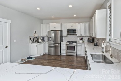 Nestled in the serene, gated community of Fox Lair Crossings and - photo 12