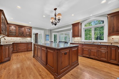 Nestled among mature trees and professionally landscaped grounds - photo 13