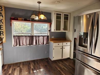 Welcome to this charming 3-bedroom, 2-bathroom mobile home. This - photo 17