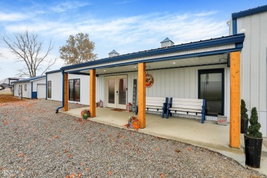 This exceptional 2-year-old barndominium offers modern country