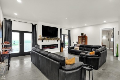 This exceptional 2-year-old barndominium offers modern country