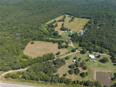 Nestled on 30 pristine acres and bordered on two sides by the - photo 12