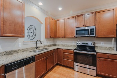 Welcome home to easy living in this hard-to-find end-unit - photo 3