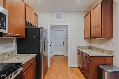 Welcome home to easy living in this hard-to-find end-unit - photo 4