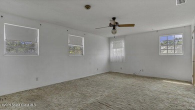 Waterfront Living with Endless Potential! Situated on navigable - photo 8