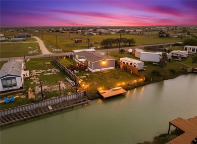 Canal-front turnkey coastal retreat with private fishing dock - photo 1