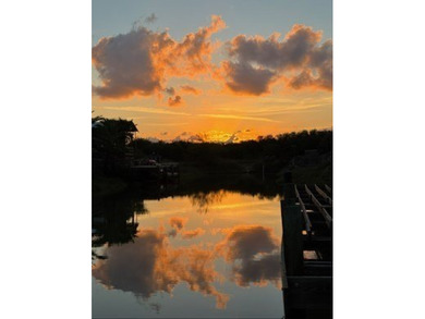 Canal-front turnkey coastal retreat with private fishing dock - photo 2