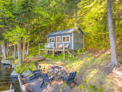 Set along approximately 150 feet of pristine shoreline on the - photo 11