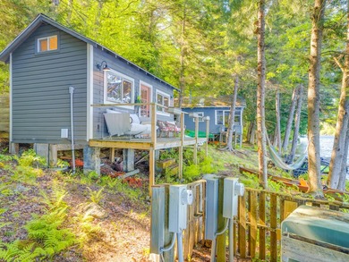 Set along approximately 150 feet of pristine shoreline on the - photo 12