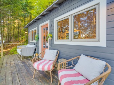 Set along approximately 150 feet of pristine shoreline on the - photo 13