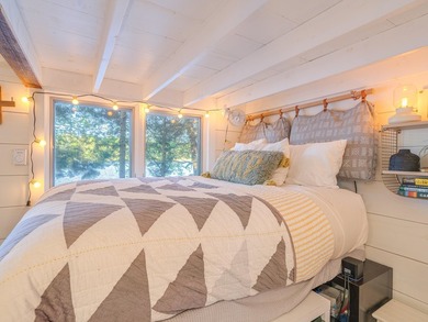 Set along approximately 150 feet of pristine shoreline on the - photo 17