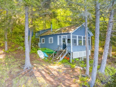 Set along approximately 150 feet of pristine shoreline on the - photo 20