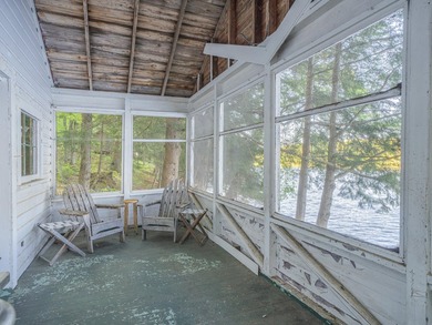 Set along approximately 150 feet of pristine shoreline on the - photo 22
